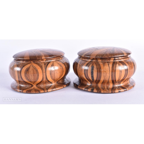 62 - A PAIR OF ANTIQUE TREEN WOOD BOXES AND COVERS. 9 cm wide.