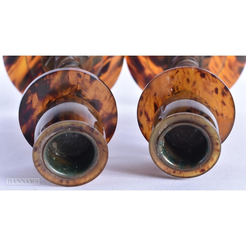 65 - A PAIR OF ART DECO FAUX TORTOISESHELL BAKELITE CANDLESTICKS. 18 cm high.