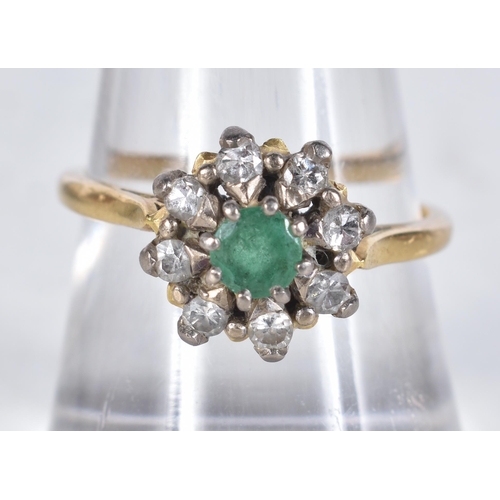 652 - An 18 Carat Gold Diamond and Emerald Ring in original box, Hallmarked 18, Size Q, weight 3.93g