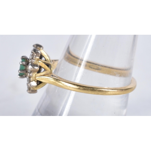 652 - An 18 Carat Gold Diamond and Emerald Ring in original box, Hallmarked 18, Size Q, weight 3.93g