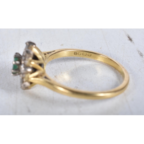 652 - An 18 Carat Gold Diamond and Emerald Ring in original box, Hallmarked 18, Size Q, weight 3.93g