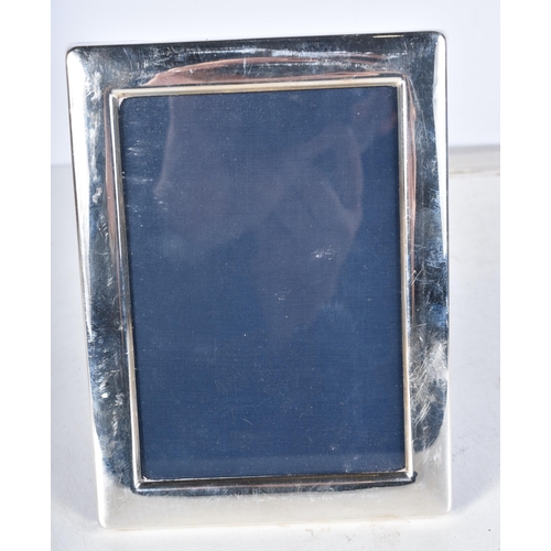 671 - A Silver Photo Frame by PH Vogel & Co.  Hallmarked Sheffield 1990.  15.8 cm x 11.8 cm