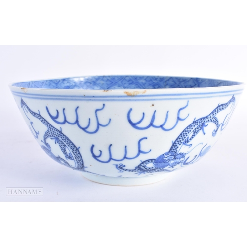 69 - A 19TH CENTURY CHINESE BLUE AND WHITE PORCELAIN DRAGON BOWL bearing Kangxi marks to base. 20.5 cm di... 