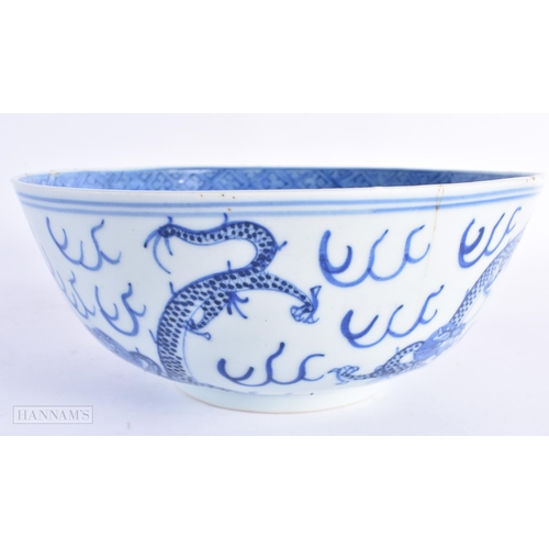 69 - A 19TH CENTURY CHINESE BLUE AND WHITE PORCELAIN DRAGON BOWL bearing Kangxi marks to base. 20.5 cm di... 