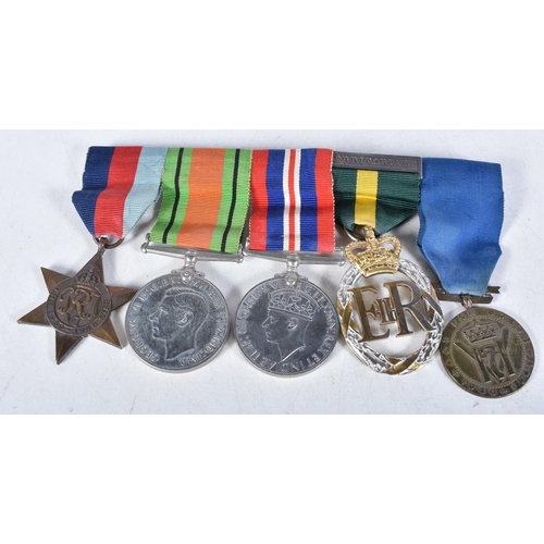 699 - Mounted Medal Group incl WW II Trio and a King Haakon VII Freedom Medal together with a TA Efficienc... 