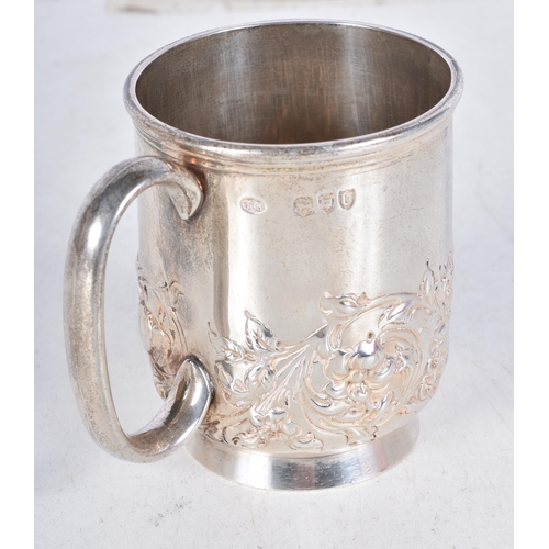 706 - A Victorian Silver Drinking Mug with Embossed Floral Decoration by Thomas Goodfellow.  Hallmarked Lo... 