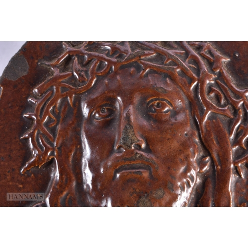 72 - AN UNUSUAL 19TH CENTURY STONEWARE PLAQUE OF CHRIST. 11.5 cm x 9.5 cm.