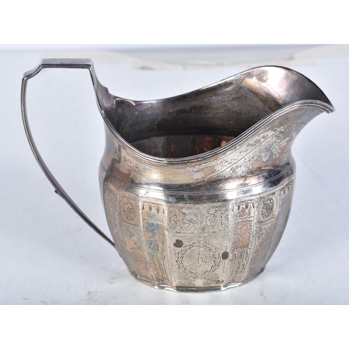 722 - A Georgian Silver Helmet Shaped Cream Jug.  Hallmarked London 1803.  10.8 cm x 14.3cm x 7.5cm, weigh... 