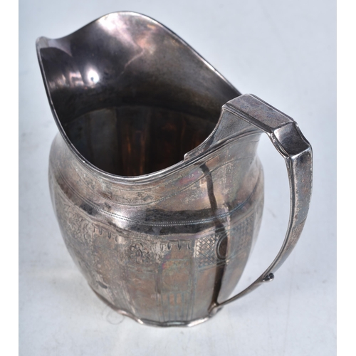 722 - A Georgian Silver Helmet Shaped Cream Jug.  Hallmarked London 1803.  10.8 cm x 14.3cm x 7.5cm, weigh... 