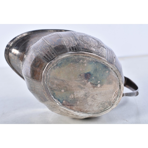 722 - A Georgian Silver Helmet Shaped Cream Jug.  Hallmarked London 1803.  10.8 cm x 14.3cm x 7.5cm, weigh... 