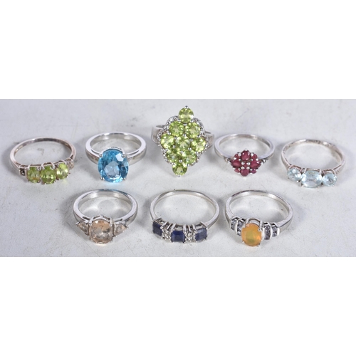 744 - 8 Sterling Silver Rings set with Gems.  Stamped 925.  Sizes M, O, R, T, P.  Total weight 24.3g (8)