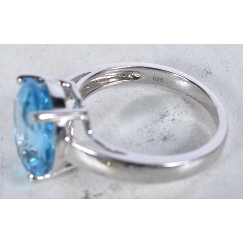 744 - 8 Sterling Silver Rings set with Gems.  Stamped 925.  Sizes M, O, R, T, P.  Total weight 24.3g (8)