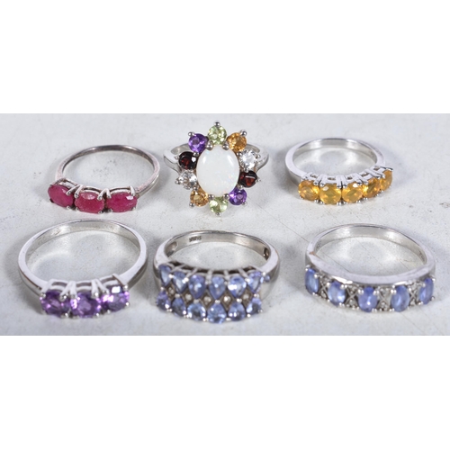 745 - 6 Sterling Silver Rings set with Gems.  Stamped 925.  Sizes L, O, S, V, P.  Total weight 18.1g (8)