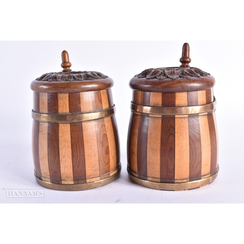 86 - A CHARMING PAIR OF ANTIQUE TREEN TANKARDS carved with leaves. 14 cm x 7 cm.