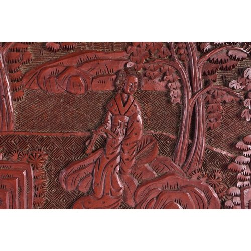 1052 - AN EARLY 19TH CENTURY CHINESE CARVED CINNABAR LACQUER TRAY Qing, decorated with figures within a lan... 