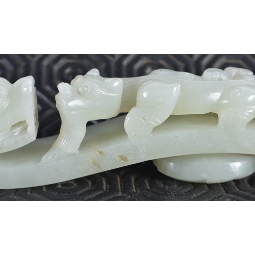 1054 - AN 18TH CENTURY CHINESE CARVED GREENISH WHITE JADE BELT HOOK Qing. 12 cm long.