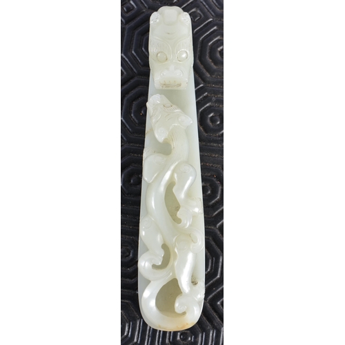 1054 - AN 18TH CENTURY CHINESE CARVED GREENISH WHITE JADE BELT HOOK Qing. 12 cm long.