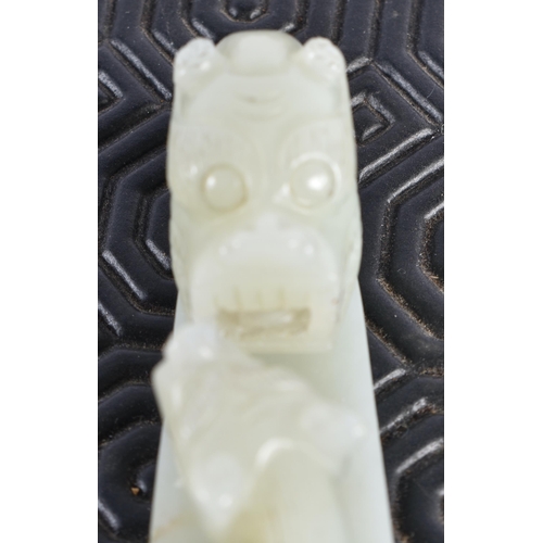 1054 - AN 18TH CENTURY CHINESE CARVED GREENISH WHITE JADE BELT HOOK Qing. 12 cm long.