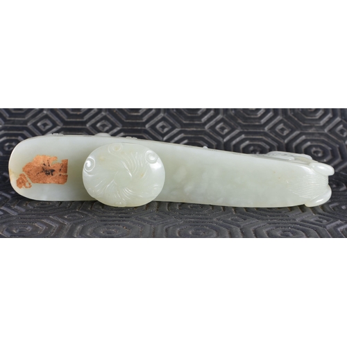 1054 - AN 18TH CENTURY CHINESE CARVED GREENISH WHITE JADE BELT HOOK Qing. 12 cm long.