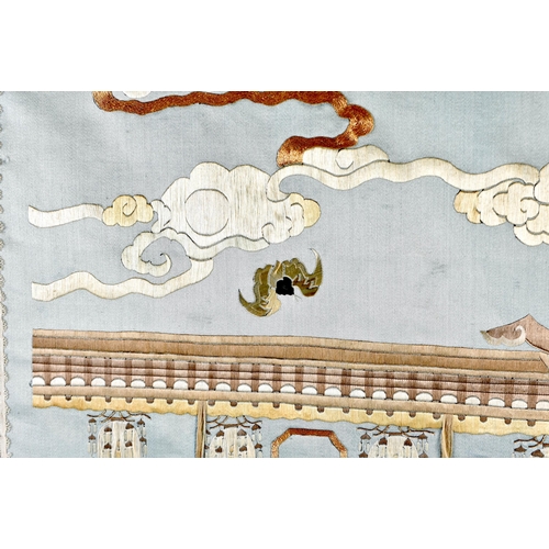 1086 - A 19TH CENTURY CHINESE SILK EMBROIDERED BLUE PANEL Qing, decorated with figures within a landscape. ... 