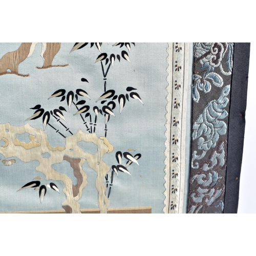 1086 - A 19TH CENTURY CHINESE SILK EMBROIDERED BLUE PANEL Qing, decorated with figures within a landscape. ... 