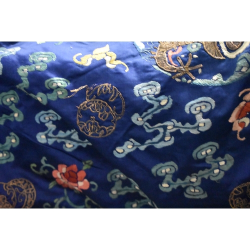 1091 - A 19TH CENTURY CHINESE SILK EMBROIDERED BLUE DRAGON ROBE Qing. 148 cm x 170 cm.