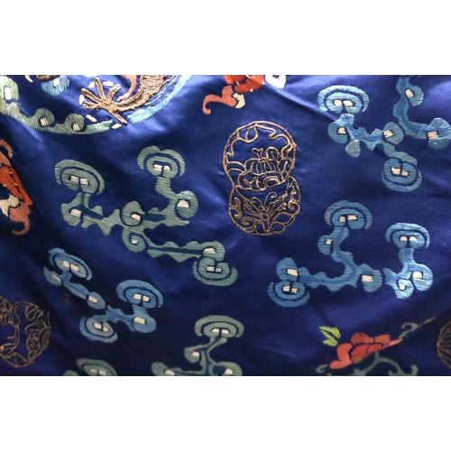 1091 - A 19TH CENTURY CHINESE SILK EMBROIDERED BLUE DRAGON ROBE Qing. 148 cm x 170 cm.