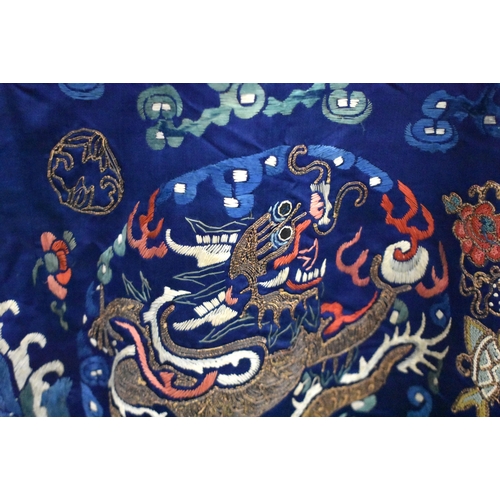 1091 - A 19TH CENTURY CHINESE SILK EMBROIDERED BLUE DRAGON ROBE Qing. 148 cm x 170 cm.