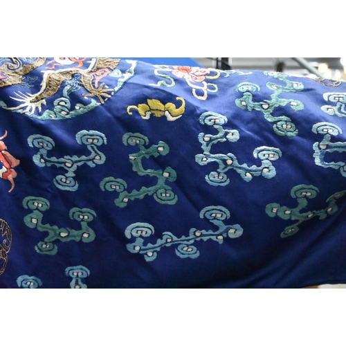 1091 - A 19TH CENTURY CHINESE SILK EMBROIDERED BLUE DRAGON ROBE Qing. 148 cm x 170 cm.