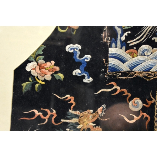 1096 - A LARGE 19TH CENTURY CHINESE FRAMED MIDNIGHT BLUE SILK DRAGON ROBE Qing. 106 cm x 86 cm.