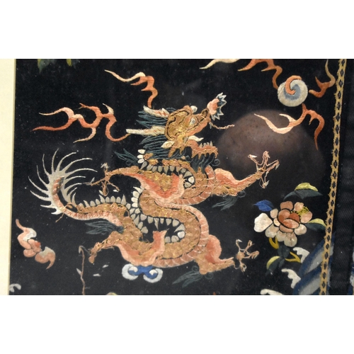 1096 - A LARGE 19TH CENTURY CHINESE FRAMED MIDNIGHT BLUE SILK DRAGON ROBE Qing. 106 cm x 86 cm.