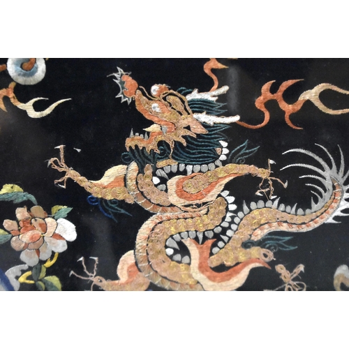 1096 - A LARGE 19TH CENTURY CHINESE FRAMED MIDNIGHT BLUE SILK DRAGON ROBE Qing. 106 cm x 86 cm.