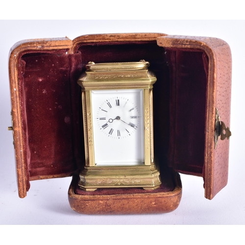 1104 - A MINIATURE ANTIQUE FRENCH CARRIAGE CLOCK within fitted leather case. 9 cm high inc handle.