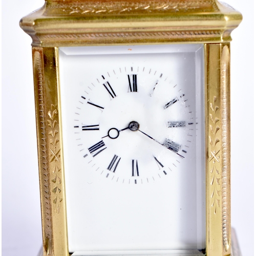 1104 - A MINIATURE ANTIQUE FRENCH CARRIAGE CLOCK within fitted leather case. 9 cm high inc handle.