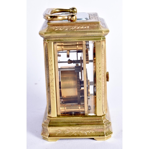 1104 - A MINIATURE ANTIQUE FRENCH CARRIAGE CLOCK within fitted leather case. 9 cm high inc handle.