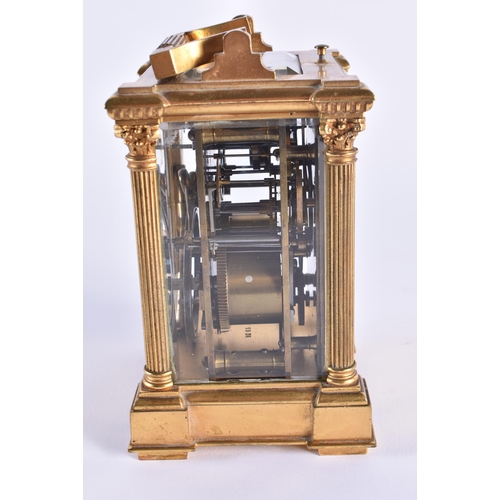 1105 - AN ANTIQUE FRENCH ENAMELLED REPEATING BRASS CARRIAGE CLOCK. 18 cm high inc handle.