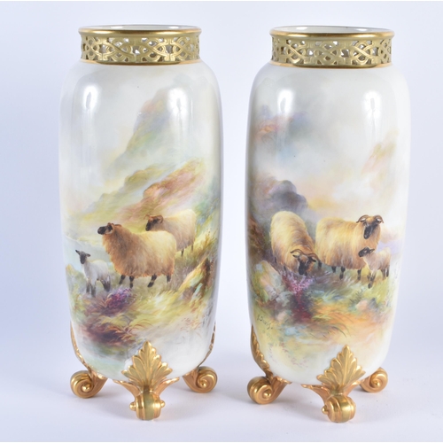 1106 - A PAIR OF ROYAL WORCESTER HARRY DAVIS PORCELAIN VASES painted with highland sheep. 22.5 cm high.