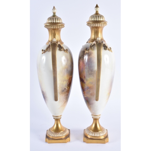 1109 - A FINE PAIR OF ROYAL WORCESTER HARRY STINTON PORCELAIN VASE by Harry Stinton. 36 cm high.