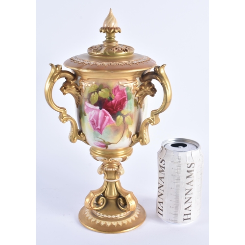 1148 - A FINE ROYAL WORCESTER TRI HANDLED BLUSH IVORY VASE AND COVER painted with foliage. 30 cm high.