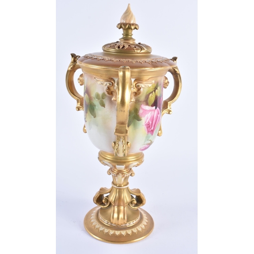 1148 - A FINE ROYAL WORCESTER TRI HANDLED BLUSH IVORY VASE AND COVER painted with foliage. 30 cm high.