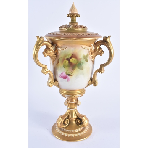 1148 - A FINE ROYAL WORCESTER TRI HANDLED BLUSH IVORY VASE AND COVER painted with foliage. 30 cm high.