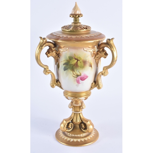 1148 - A FINE ROYAL WORCESTER TRI HANDLED BLUSH IVORY VASE AND COVER painted with foliage. 30 cm high.