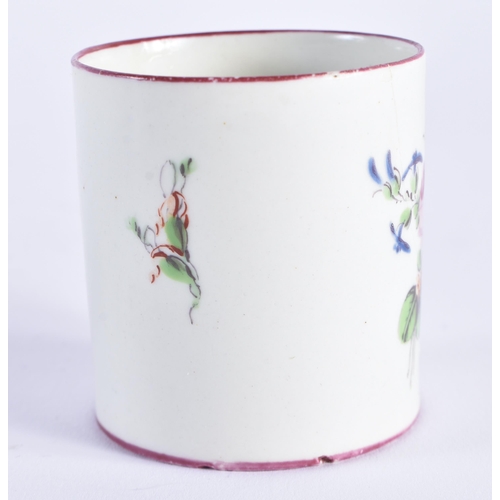 1152 - 18th century Mennecy coffee can painted with flowers under a puce border. 6 cm high.