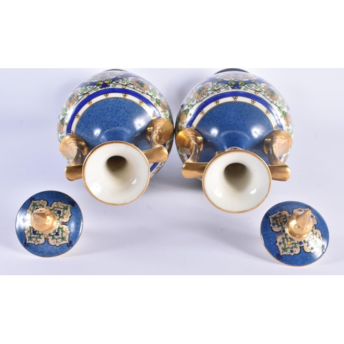 1153 - A PAIR OF ROYAL WORCESTER TWIN HANDLED PORCELAIN VASES AND COVERS painted in relief with Islamic sty... 