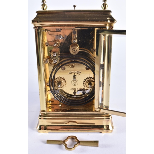 1166 - AN ANTIQUE FRENCH TRIPLE DIAL REPEATING BRASS CARRIAGE CLOCK. 18 cm high inc handle.