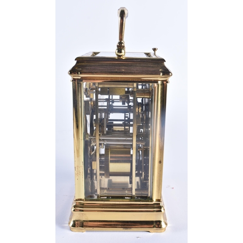 1166 - AN ANTIQUE FRENCH TRIPLE DIAL REPEATING BRASS CARRIAGE CLOCK. 18 cm high inc handle.