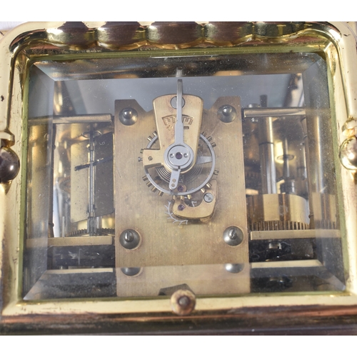 1166 - AN ANTIQUE FRENCH TRIPLE DIAL REPEATING BRASS CARRIAGE CLOCK. 18 cm high inc handle.