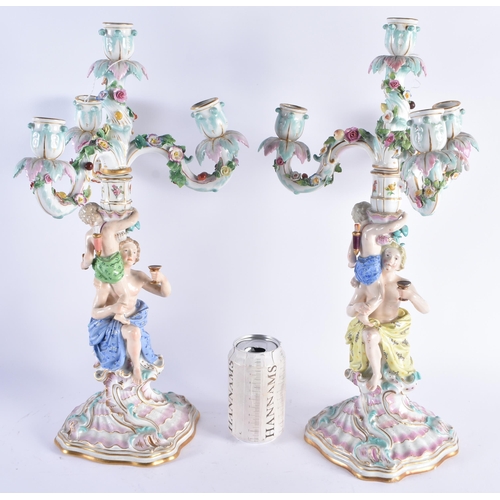 1198 - A PAIR OF 19TH CENTURY GERMAN MEISSEN PORCELAIN CANDELABRA formed with figures and putti. 47 cm x 18... 