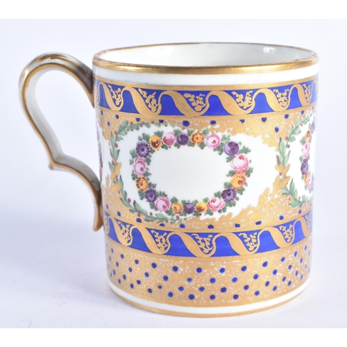 1206 - Late 18th century Sevres large coffee can painted with wreaths of flowers and ornately gilded on a c... 