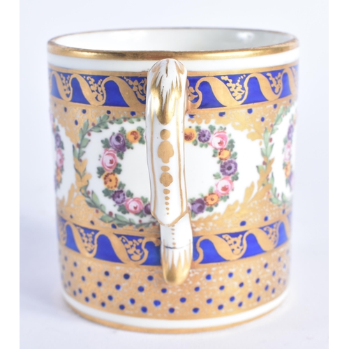 1206 - Late 18th century Sevres large coffee can painted with wreaths of flowers and ornately gilded on a c... 